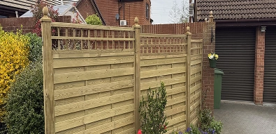 Garden fencing beside driveway